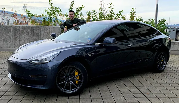 Matthew with his new Tesla.